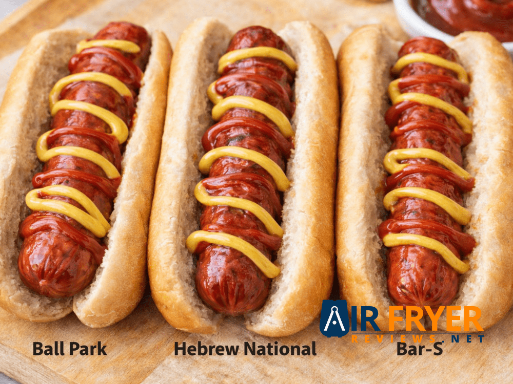 Side by side cooked hot dogs in buns with ketchup and mustard on a wooden board Air Fryer Reviews