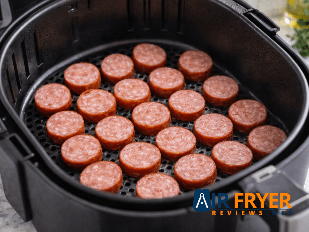 Properly arranged kielbasa in a single layer inside an air fryer basket Air Fryer Reviews
