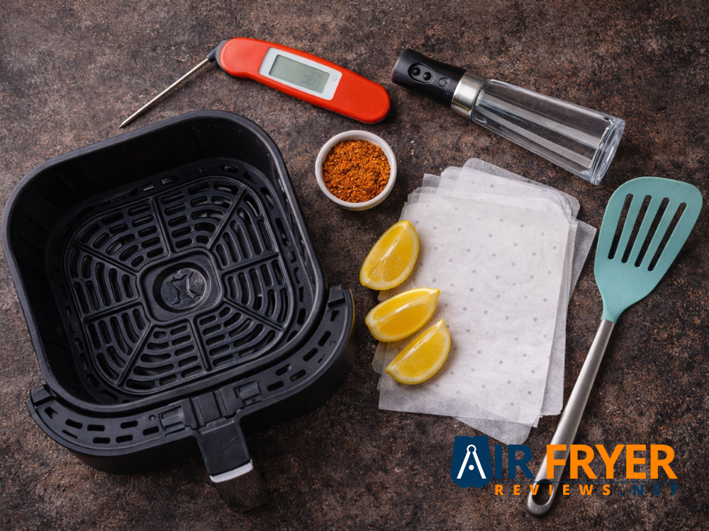 Air fryer cooking tools and ingredients laid out 1 Air Fryer Reviews